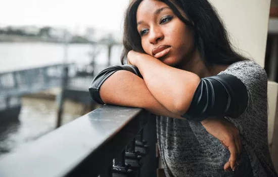 person staring out window