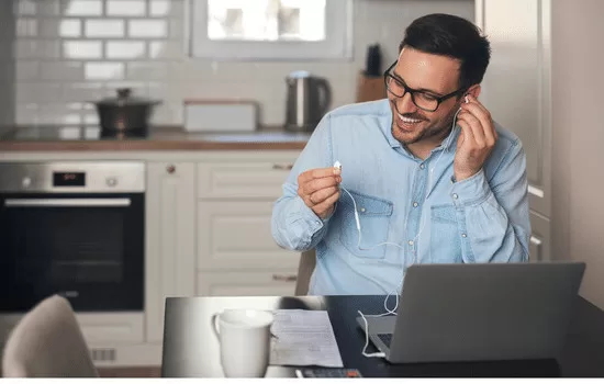 Man happy putting on his ear-piece