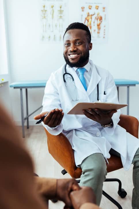 male psychiatric nurse practitioner in appointment talking with patient